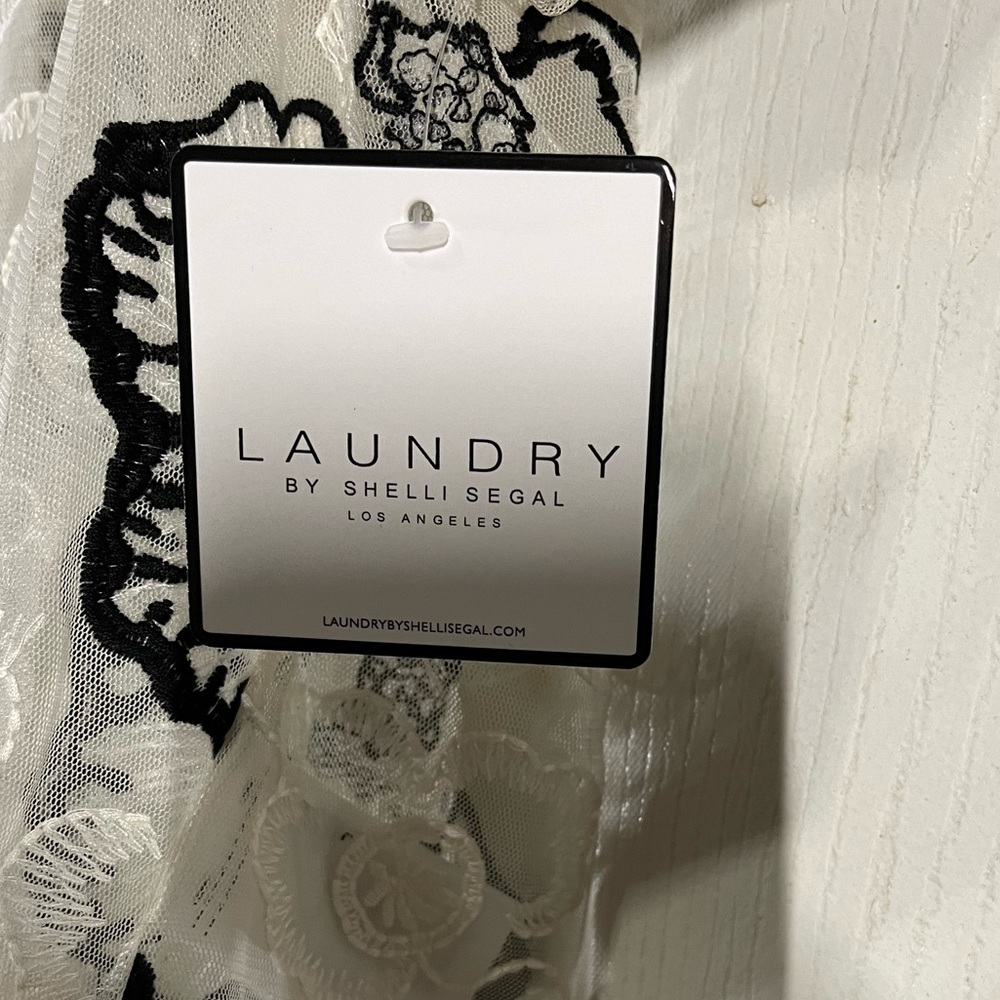 See through Laundry top. Cream color.